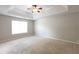 This carpeted bedroom features a ceiling fan and a window that provides plenty of natural light at 260 Redding Rdg, Atlanta, GA 30349