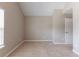 This carpeted bedroom features a vaulted ceiling and trim, and a window provides plenty of natural light at 260 Redding Rdg, Atlanta, GA 30349