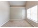 This carpeted bedroom features a vaulted ceiling and a window that provides plenty of natural light at 260 Redding Rdg, Atlanta, GA 30349