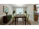 Dining area with natural light, neutral walls, and a stylish table for eight at 260 Redding Rdg, Atlanta, GA 30349