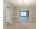 Well-lit dining room with chair rail and open access to other rooms at 260 Redding Rdg, Atlanta, GA 30349