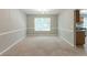 Traditional dining room adjacent to kitchen with natural light and chair rail at 260 Redding Rdg, Atlanta, GA 30349