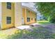 A view of the home's exterior, facing yard with a patio, door, and several windows at 260 Redding Rdg, Atlanta, GA 30349
