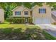 Charming two-story home with a well-maintained lawn and a two-car garage at 260 Redding Rdg, Atlanta, GA 30349