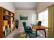 Bright home office with a large window, wooden desk and bookshelf, perfect for productivity at 260 Redding Rdg, Atlanta, GA 30349