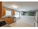 The kitchen features natural-tone cabinetry, stainless steel appliances, and granite countertops at 260 Redding Rdg, Atlanta, GA 30349