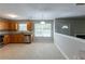 Spacious open-concept kitchen with wood cabinets and adjacent breakfast area at 260 Redding Rdg, Atlanta, GA 30349