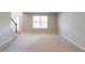 Bright and spacious living room with neutral carpeting and natural light at 260 Redding Rdg, Atlanta, GA 30349