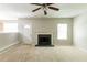 Comfortable living room featuring fireplace and a ceiling fan at 260 Redding Rdg, Atlanta, GA 30349