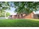 Lush backyard with a wooden deck, surrounded by mature trees and a wooden fence for added privacy at 300 Saddle Creek Ln, Roswell, GA 30076