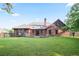 Expansive backyard featuring a well-maintained lawn, wooden deck, and privacy fence, perfect for outdoor entertaining at 300 Saddle Creek Ln, Roswell, GA 30076