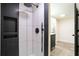 Modern bathroom featuring a sleek, tiled shower with black hardware and niche for toiletries at 300 Saddle Creek Ln, Roswell, GA 30076