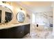 Modern bathroom featuring double vanity, marble tile, soaking tub and gold hardware at 300 Saddle Creek Ln, Roswell, GA 30076