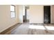Bright bedroom with a window, wooden floors and a door that allows access to a connecting bathroom at 300 Saddle Creek Ln, Roswell, GA 30076