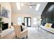 Spacious living room with high ceilings, skylights, fireplace, and stylish furniture at 300 Saddle Creek Ln, Roswell, GA 30076