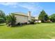 Large backyard with well-maintained lawn and a deck, ideal for relaxation and outdoor activities at 4077 High Country Dr, Douglasville, GA 30135