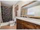 Bathroom featuring a shower and vanity with a carved wooden design at 4077 High Country Dr, Douglasville, GA 30135