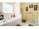 Bright primary bathroom features a tub, shower, and natural light at 4077 High Country Dr, Douglasville, GA 30135