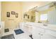 Bright primary bathroom features a double vanity, large mirror, and natural light at 4077 High Country Dr, Douglasville, GA 30135