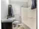 Cozy bathroom featuring a tiled floor, tub and shower, and a vanity with sink, creating a functional and comfortable space at 734 Meadowlark Dr, Villa Rica, GA 30180