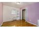Inviting bedroom featuring hardwood floors, a closet, and soft lavender walls for a tranquil retreat in your new home at 734 Meadowlark Dr, Villa Rica, GA 30180