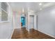 Bright bedroom with wood-look flooring, closet, and fresh paint offering a versatile space for comfort and personalization at 734 Meadowlark Dr, Villa Rica, GA 30180