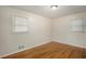 Well-lit bedroom with hardwood floors and ample natural light creating a cozy and inviting space to unwind in your new home at 734 Meadowlark Dr, Villa Rica, GA 30180