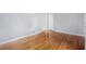 Bright living room showing pristine hardwood floors, neutral-colored walls, and an open doorway to another room at 734 Meadowlark Dr, Villa Rica, GA 30180