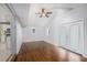 Bright room features hardwood floors, ceiling fan, and adjacent kitchen access, creating a seamless and airy atmosphere at 734 Meadowlark Dr, Villa Rica, GA 30180