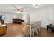 Open dining room with hardwood floors, table, chairs, and a view into the living room; great for entertaining at 136 Pine St, Covington, GA 30014