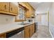 Functional kitchen with wood cabinets, stainless steel appliances, and plenty of counter space; perfect for meal prep at 136 Pine St, Covington, GA 30014