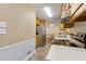 Traditional-style kitchen features stainless steel appliances and light wood cabinetry at 136 Pine St, Covington, GA 30014