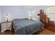 Comfortable main bedroom with hardwood floors and a ceiling fan at 136 Pine St, Covington, GA 30014