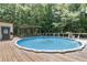 Enjoy this backyard pool with ample decking, perfect for relaxing and entertaining at 136 Pine St, Covington, GA 30014