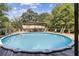 Backyard pool with deck, plenty of room for entertaining and relaxation at 136 Pine St, Covington, GA 30014