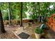 Serene backyard setting with cozy seating areas and a charming shed at 1767 Tidewell Trce, Lawrenceville, GA 30043