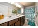 Well-lit bathroom featuring a double vanity, ample counter space and modern fixtures at 1767 Tidewell Trce, Lawrenceville, GA 30043