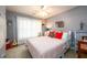 Bright bedroom with modern decor, a large bed, soft carpet, and ample space at 1767 Tidewell Trce, Lawrenceville, GA 30043