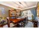 Charming dining room with a wooden table, elegant china cabinet, and bright natural light at 1767 Tidewell Trce, Lawrenceville, GA 30043