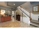 Elegant foyer showcasing tile floors, a staircase, and view into a dining area at 1767 Tidewell Trce, Lawrenceville, GA 30043