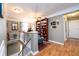 Second floor hallway features decorative railing, hardwood floors and a built-in bookcase at 1767 Tidewell Trce, Lawrenceville, GA 30043