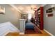 Second floor hallway features decorative railing, hardwood floors and a built-in bookcase at 1767 Tidewell Trce, Lawrenceville, GA 30043