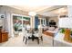 Eat-in kitchen featuring stainless steel appliances, a breakfast nook, and an adjacent living area at 1767 Tidewell Trce, Lawrenceville, GA 30043