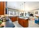 Open concept kitchen featuring stainless steel appliances, a breakfast nook, and dark countertops at 1767 Tidewell Trce, Lawrenceville, GA 30043