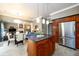 Spacious kitchen featuring stainless steel appliances, a center island, and dark countertops at 1767 Tidewell Trce, Lawrenceville, GA 30043
