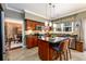 Modern kitchen featuring stainless steel appliances, a center island, and wooden cabinets at 1767 Tidewell Trce, Lawrenceville, GA 30043