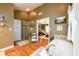 Bright main bathroom features a soaking tub, glass shower, and views into the main bedroom at 1767 Tidewell Trce, Lawrenceville, GA 30043