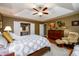 Beautiful main bedroom features hardwood floors, a sitting area, and ensuite bathroom at 1767 Tidewell Trce, Lawrenceville, GA 30043