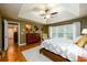 The main bedroom suite features a tray ceiling, large windows, wood floors and neutral colors at 1767 Tidewell Trce, Lawrenceville, GA 30043