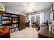 Spacious office with built-in shelving, desks, and a comfortable workspace at 1767 Tidewell Trce, Lawrenceville, GA 30043